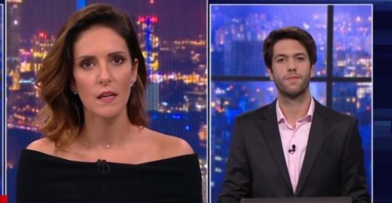 Monalisa Perrone, mediadora do Grande Debate, ao lado do jornalista Caio Coppola - CNN Brasil